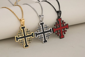 Detailed view of Jerusalem cross pendants in gold, silver, and black finishes on chains