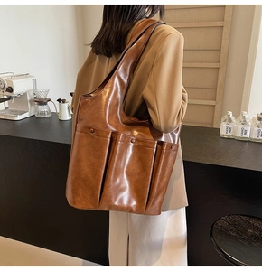 Brown vintage large capacity tote bag with functional pockets and glossy finish