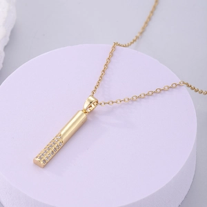 Macro shot of 18K gold plated bar necklace with micro-paved sparkling cubic zirconia