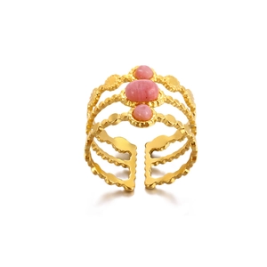 Close-up of golden multi-layer wave ring with pink oval stones and adjustable band