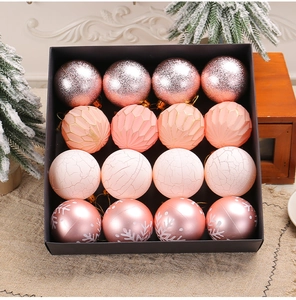 Detailed set of 16 pink Christmas ornaments with glitter and snowflake patterns in box