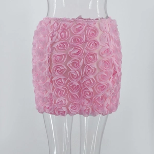 Close-up of pink mini skirt featuring 3D rose floral texture and slim bodycon fit