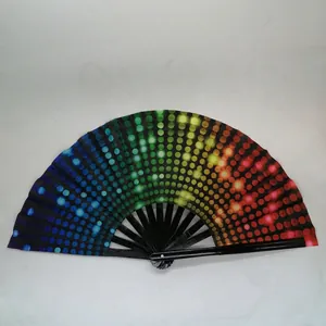 Macro detail of folding fan featuring black ribs and vibrant rainbow gradient polka dot fabric