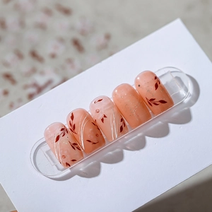 Japanese style peach pink press-on nails with red leaf hand-painted designs and glitter