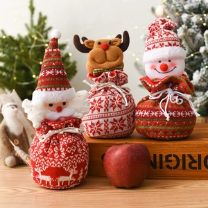 Three-piece set of knitted Christmas gift bags with Santa, reindeer and snowman designs
