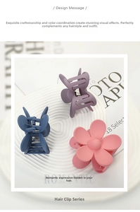 Three matte Morandi floral hair claws in pink, purple, and blue colors set on a tray