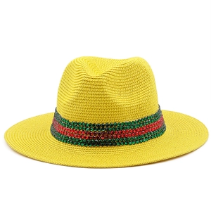 Yellow Panama straw hat with red and green rhinestone band for outdoor beach sun protection