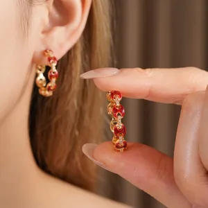 18k gold plated pig nose hoop earrings with red enamel and pavé zircon crystals