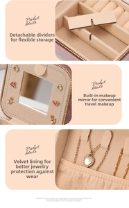Pink jewelry box detail with inner mirror, necklace hooks and velvet lining for protection