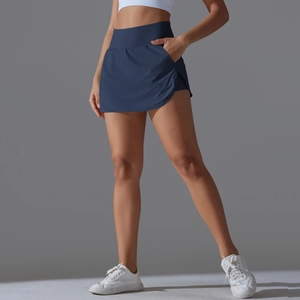 Navy blue high-waisted tennis skort featuring a curved hem and side pockets for sports