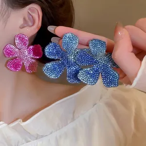 Elegant oversized floral rhinestone earrings in pink and blue gradient crystal finishes