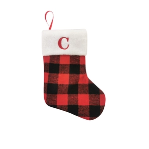 Detail of red and black buffalo plaid Christmas stocking with embroidered letter C