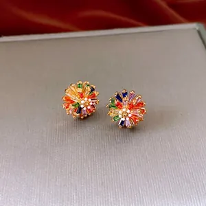 Luxury floral stud earrings featuring colorful cubic zirconia on a golden metal base