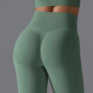 Detailed close-up of high waist seamless yoga pants showing scrunch butt and green knit texture