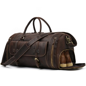 Detail of vintage crazy horse leather travel bag featuring a dedicated side shoe compartment