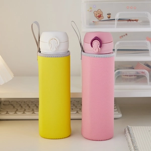 Detail of pink and yellow insulated cup sleeves with portable carrying lanyards