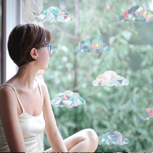 Cloud-shaped rainbow prism window film showing decorative holographic effects on glass