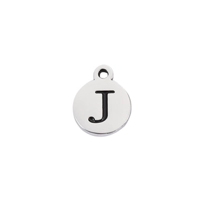 Macro detail of silver stainless steel round pendant with black engraved letter J