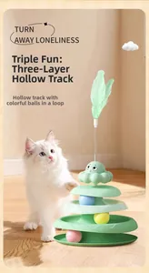 Close-up of three-level green cat turntable toy with colorful spinning balls and feather