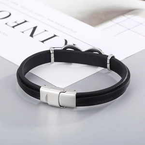 Detail of black double-layer leather bracelet with silver stainless steel magnetic clasp
