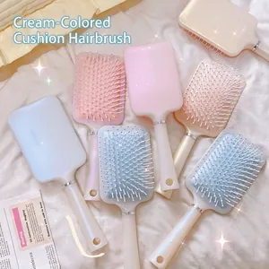 Pastellfarbene Luftkissen-Massagebürsten in Rosa, Blau und Apricot mit Perleffekt