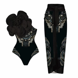 Detail of one-shoulder swimsuit with 3D flower and matching ethnic print sarong