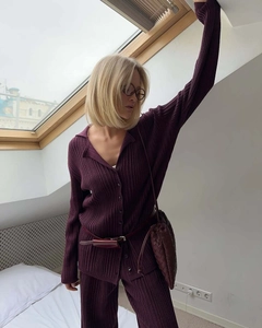 Close-up of deep purple knit set showing ribbed texture on polo cardigan and trousers