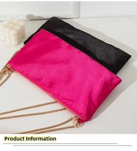 Detail view of satin tote bags with sleek zipper closure and golden chain straps