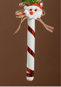 Detail of candy cane ornament with plush Santa and a festive red and white ribbon bow