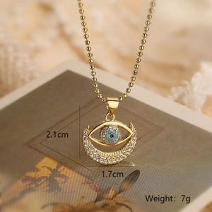 Detailed view of evil eye pendant showing dimensions 2.1cm by 1.7cm and 7g weight