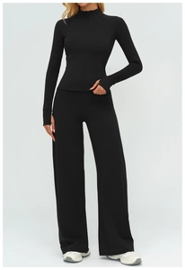 Detail of black sports set featuring stand collar zipper jacket with thumbhole sleeve cuffs