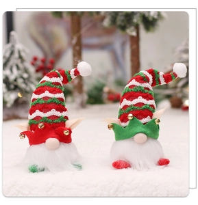 Detail of Christmas gnomes with LED lights, striped knitted hats, and golden bells