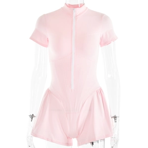 Detail of pink bodycon romper featuring a white front zipper and pleated A-line skirt