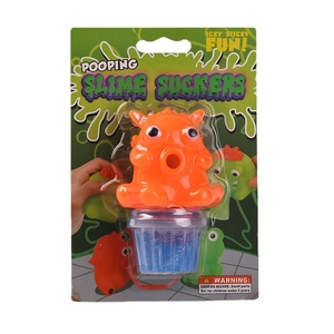 Pooping Slime Suckers orange monster toy with blue slime in fun themed packaging