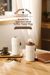 Close-up of smart 316 stainless steel coffee cup with temperature display and carry strap