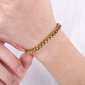 Close-up of golden Franco link bracelet showing the intricate dragon bone chain texture