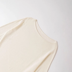 Minimalist cream knit crewneck sweater with fine texture and ribbed details