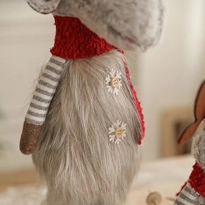 Nordic plush reindeer doll with a red knit scarf and wood snowflake buttons for Christmas decor