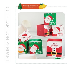 Close-up of Merry Christmas paper gift bags with Santa Claus and snowman cartoon patterns