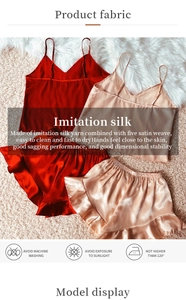 Detail of wine red and champagne silk pajama set with satin texture and washing instructions