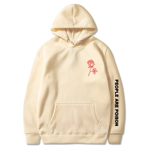 Detail of People Are Poison hoodie sleeve text and rose print on cream fabric
