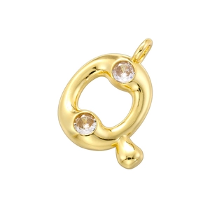 Detailed macro view of 18K gold plated letter Q pendant with bamboo style texture and crystals