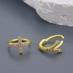 Golden cross and crown nose rings with sparkling diamonds for a minimalist chic look