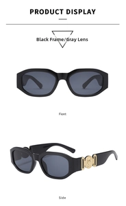 Detailed view of black rectangle frame sunglasses with gold circular temple relief