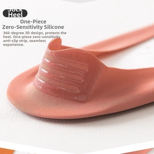 Detail of coral seamless no-show sock featuring anti-slip silicone grip on the heel