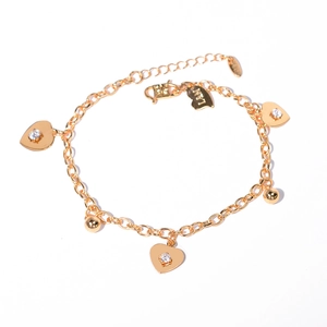 Detailed shot of golden heart bracelet with sparkling crystals and adjustable clasp