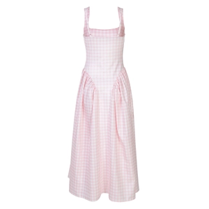 Detail view of the back of a pink and white plaid sundress with adjustable straps and smocking