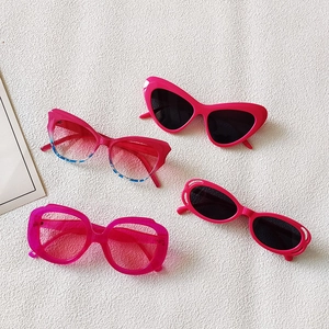 Flat lay of four different stylish rose red sunglasses with various fashion frame designs