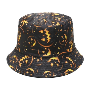 Detail of black Halloween bucket hat featuring glowing orange Jack-o'-lantern patterns