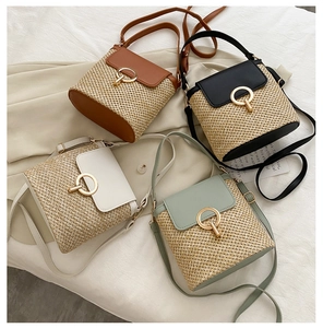 Straw and leather woven crossbody bags in four colors with gold ring buckle